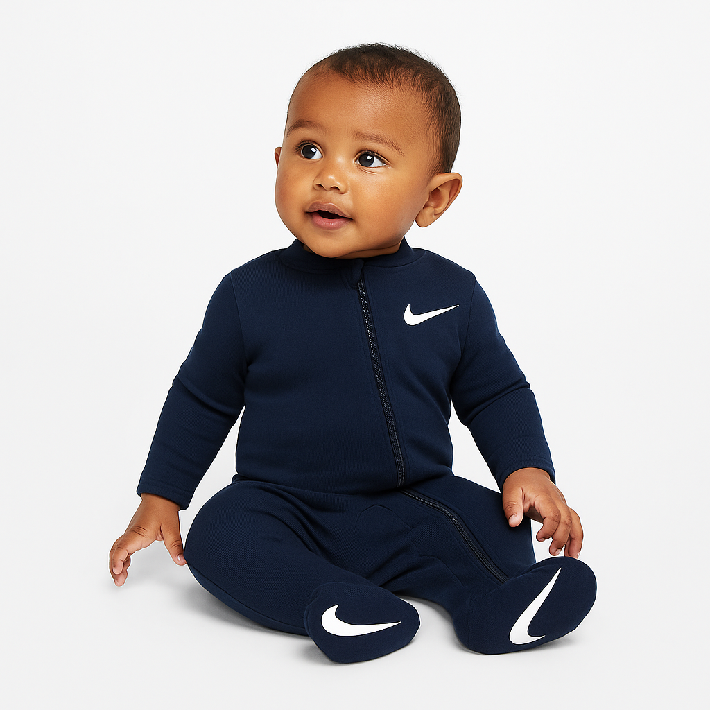 Nike Baby Essential Pointelle Coverall in Midnight Navy with white Swoosh, footed design, and long sleeves for cozy comfort.
